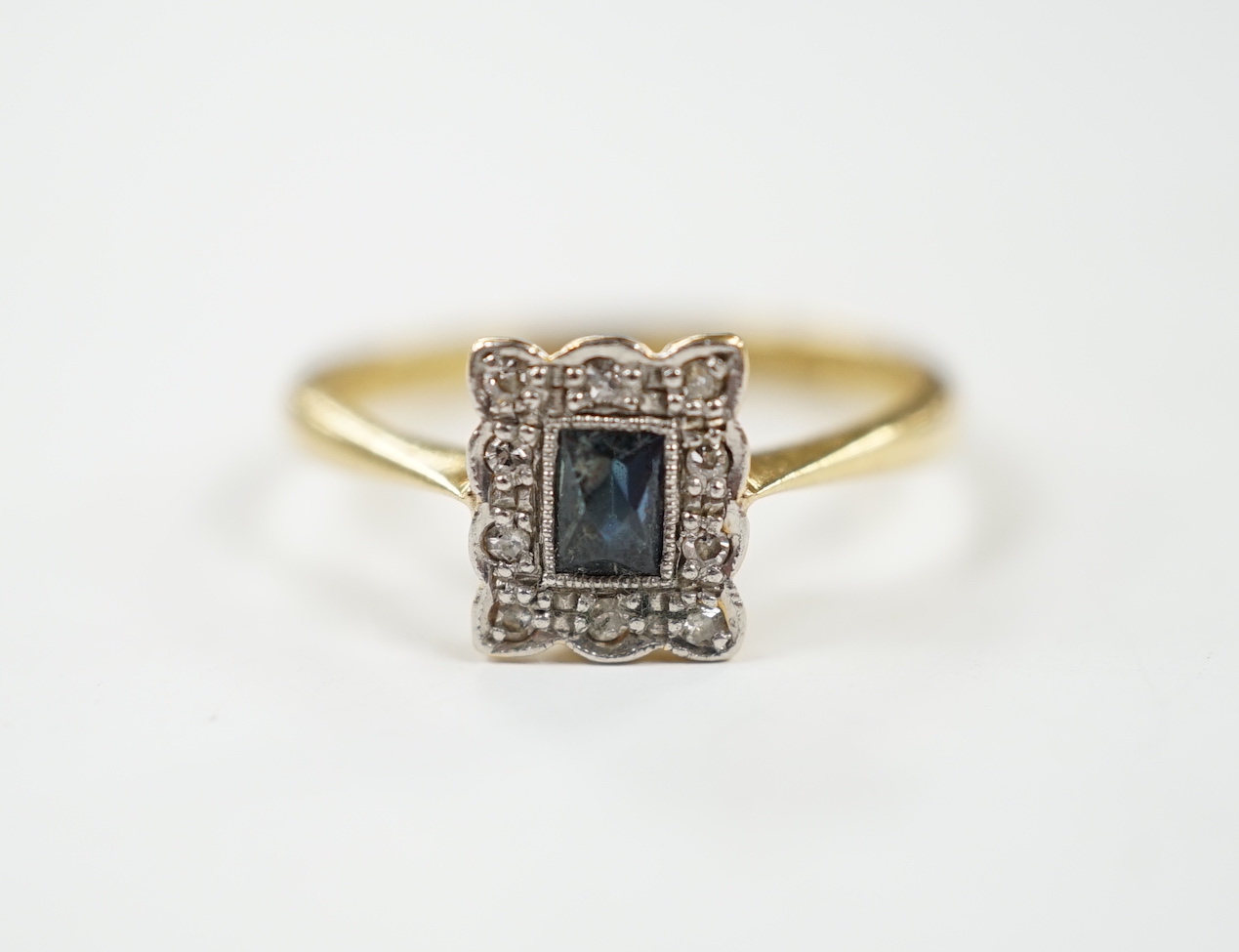 A 1920's 18ct and plat, sapphire and diamond set rectangular cluster ring, size M, gross weight 2.8 grams.